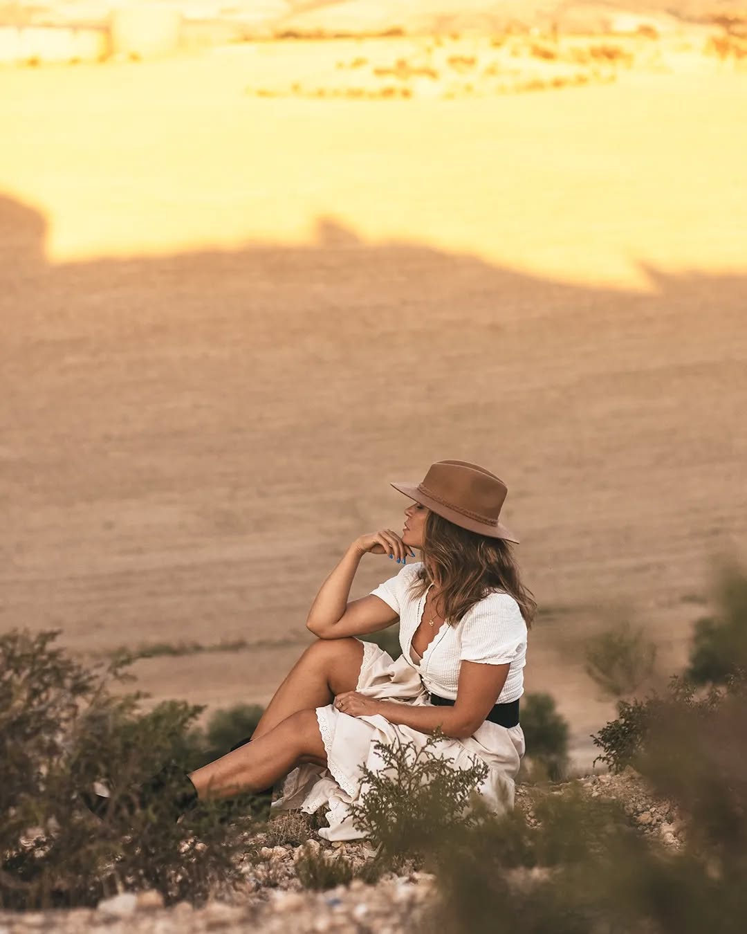 Geometric shadows cast by lattice windows on stone floor