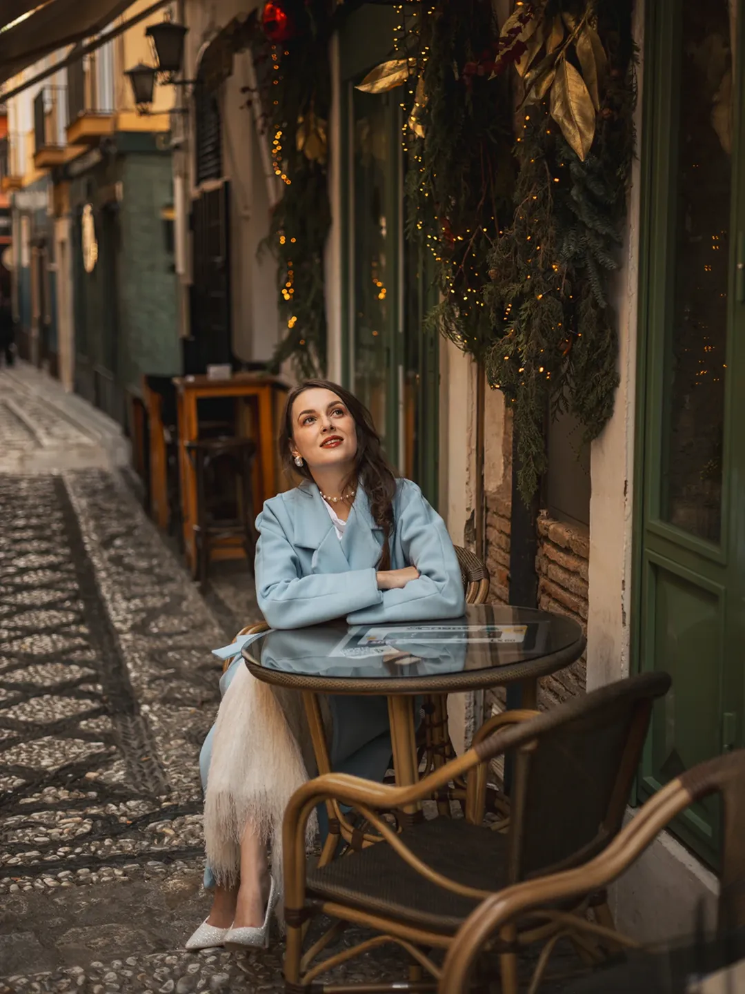 Family reading christmas book by fireplace